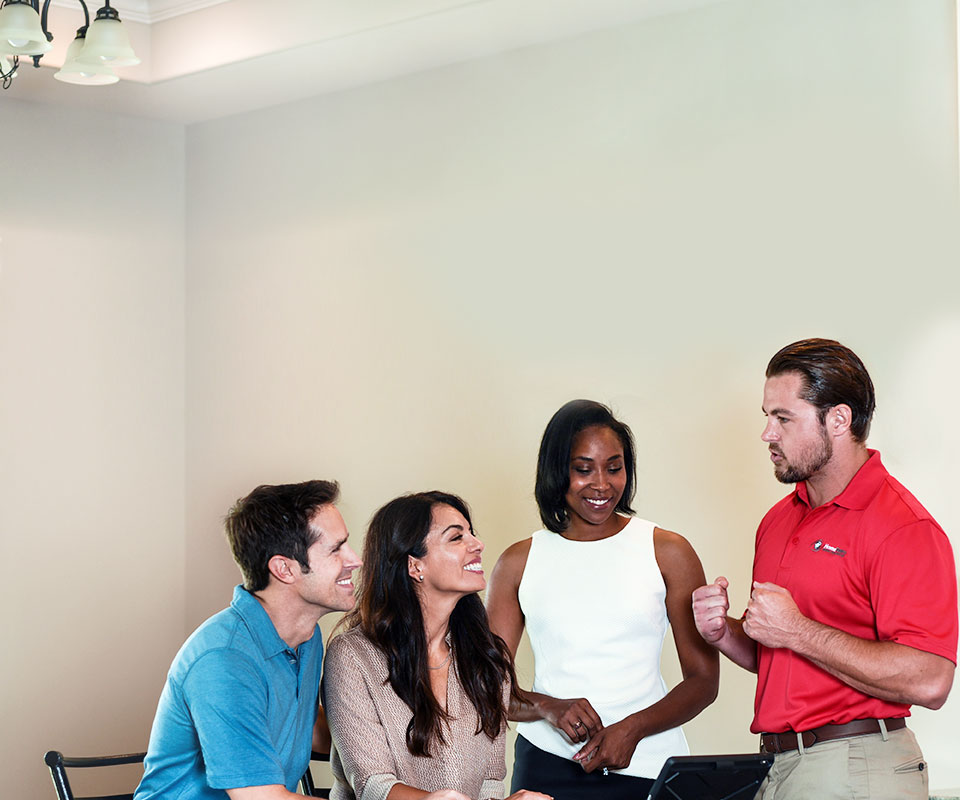 HomeTeam home inspector talking to family